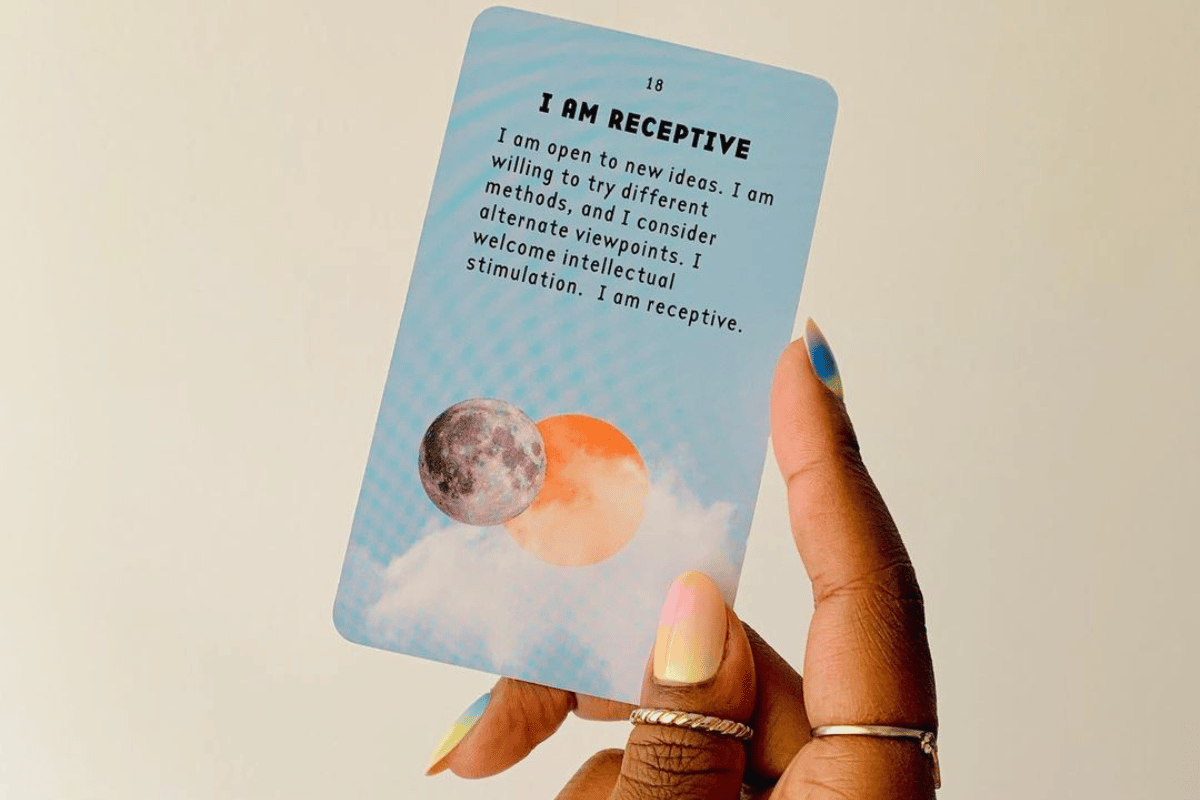 woman holding affirmation card