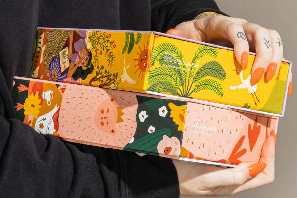 woman holding puzzles