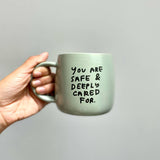 Safe and Cared For Coffee Mug